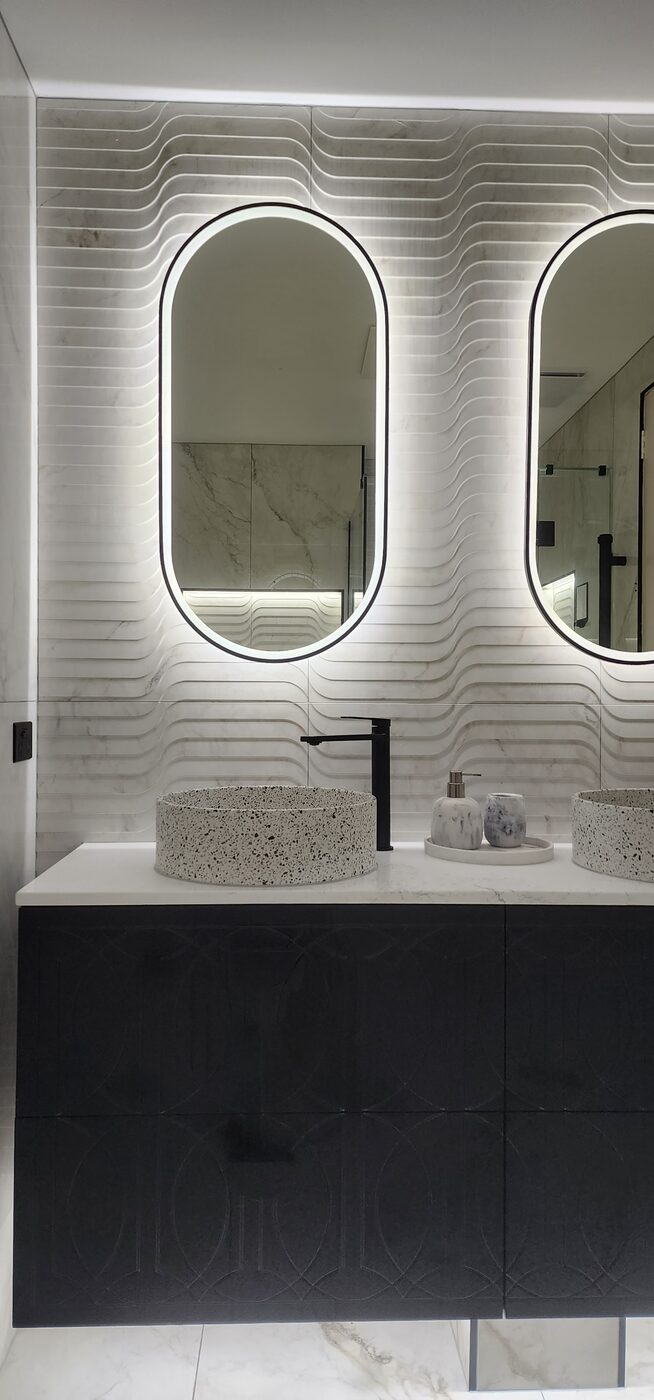 Backlit oval mirror and stone basin, Albert Park