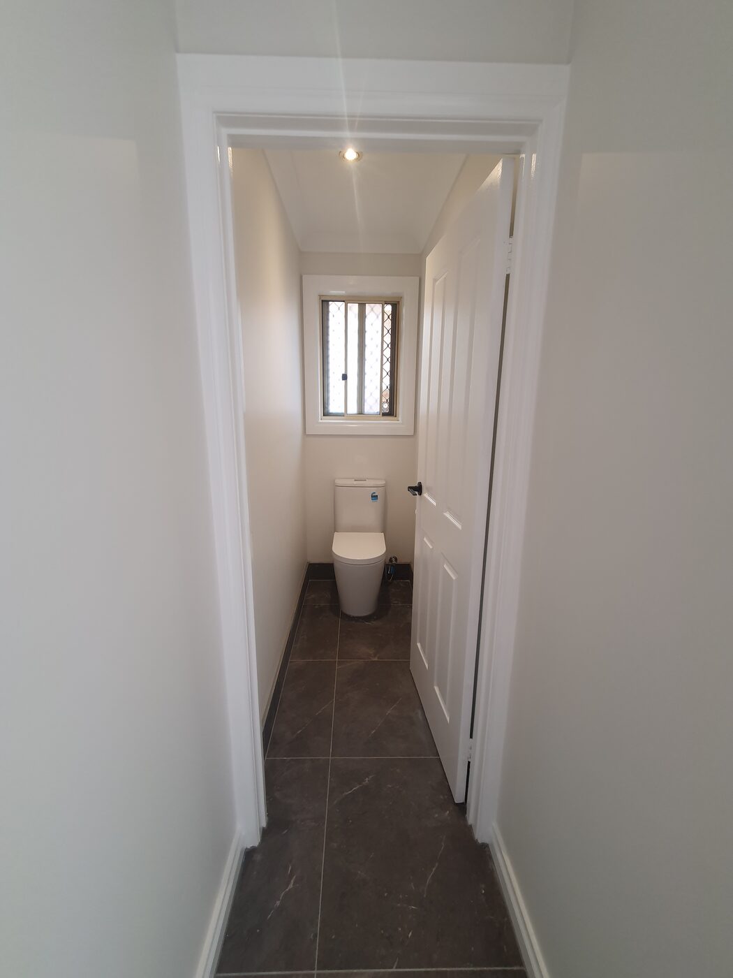 Modern bathroom with timber vanity, walk-in shower and bath, Dandenong
